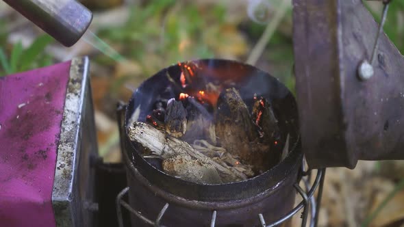 Beekeeper Lights Bee Smoker with Gas Touch.