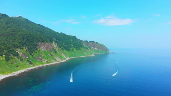 Shiretoko peninsula coastal view with fishing boats