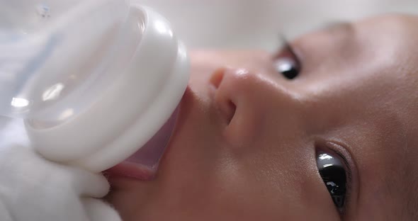 Baby Drinking Water From Bottle