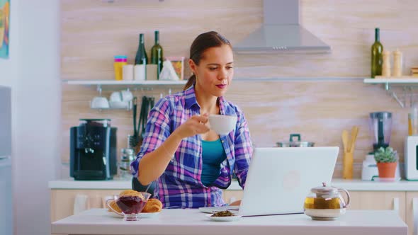 Woman Typing on Laptop