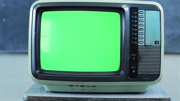 Old TV with Green Screen in a Classroom. Aesthetics of the 80s.