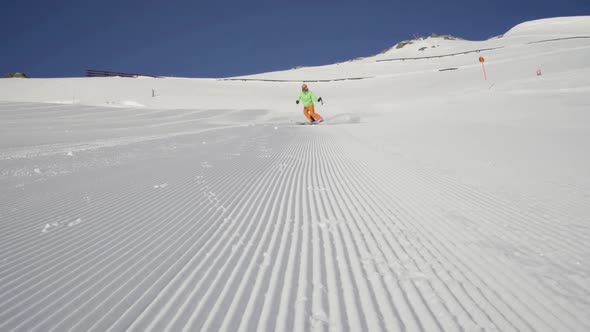 Slow Motion Good Skier Skiing and Stopping With Snow Splashing