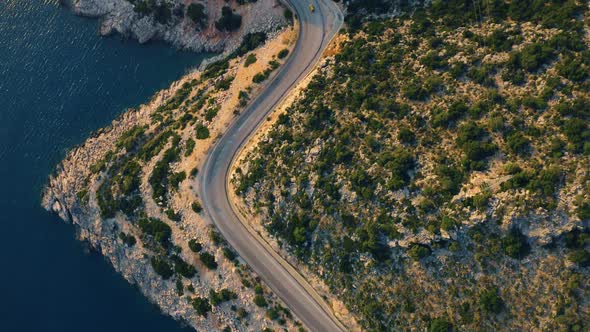 Aerial Drone View of Mountain Road Near the Turquoise Sea in Summer