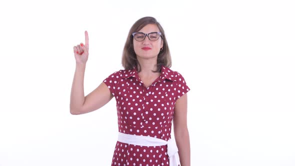 Happy Beautiful Woman with Eyeglasses Pointing Up