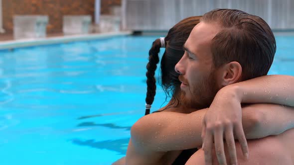 Couple embracing in swimming pool