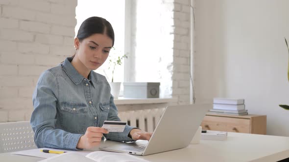 Online Shopping with Credit Card by Young Woman