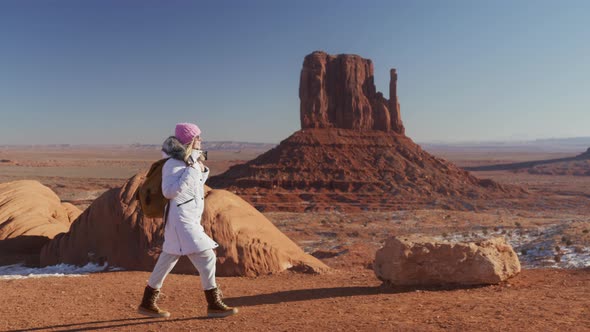 Slow Motion Young Woman Hiking in Monument Valley Wilderness on Winter Morning