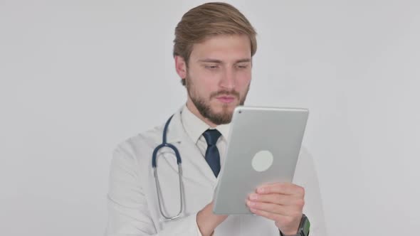 Young Doctor Using Digital Tablet on White Background