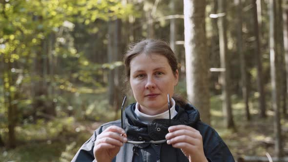 Portrait of Woman with Freckles in Forest