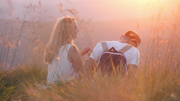 Couple having fun at sunset alt