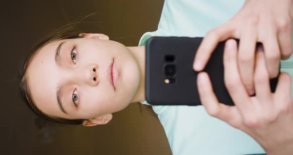Ten Years Old Girl Take a Photo with Her Smartphone