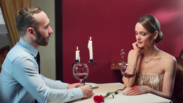 Elegant Female and Man Enjoying Romantic Meeting at Luxury Restaurant