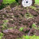 A Tractor Drives Across an Agricultural Field in a Garden Plot and Plows the Land with a Plow - VideoHive Item for Sale
