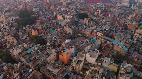 India, Delhi city center slums roofs aerial 4k drone footage, evening dusk