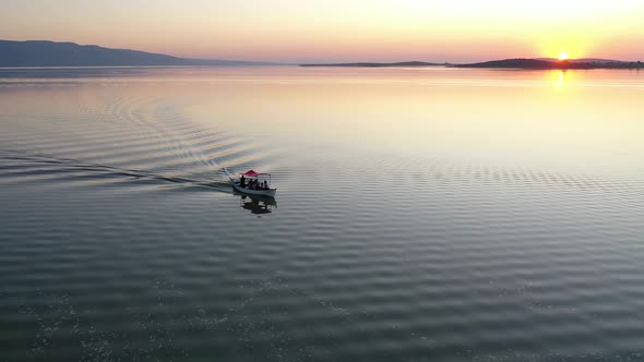 Fishing boat on lake at sunset golyazi, bursa turkey