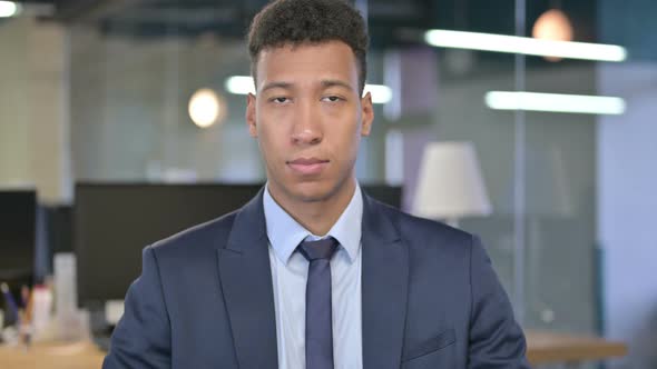 Portrait of Young Businessman Looking at the Camera