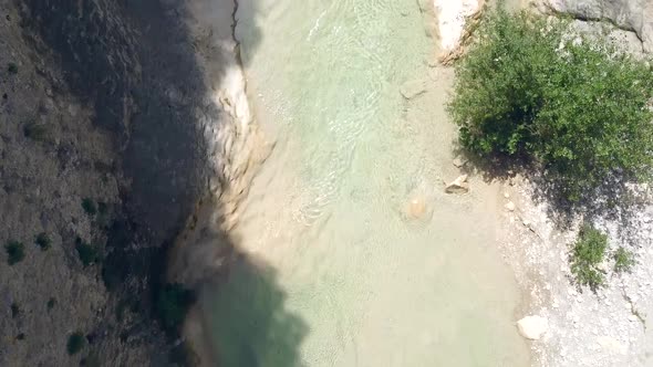 Aerial View Over River In Mountains