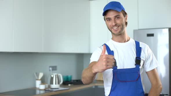 Professional Handyworker Showing Thumbs Up, Ad of High-Quality Home Repairs