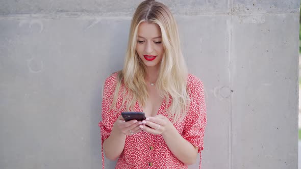 Cheerful Young Woman Using Smartphone