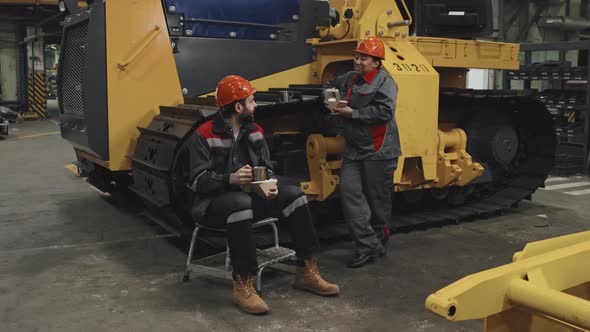 Coworkers Having Lunch at Factory