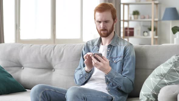 Man Using Smartphone for Online Financial Trading