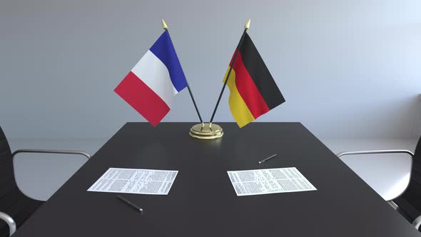 Flags of France and Germany on the Table