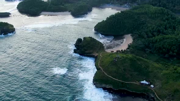 Paradise beaches between cliffs on Kasap coast, East Java Indonesia, aerial view