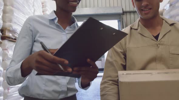 Young workers interacting in a warehouse