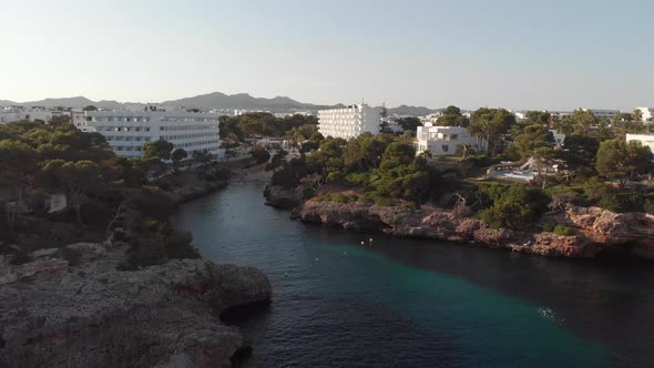 AERIAL: Flying over Bay of Cala de Egos in Cala D'or on Mallorca Island