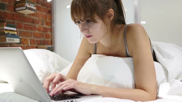 Headache Tired Woman Working on Laptop in Bed