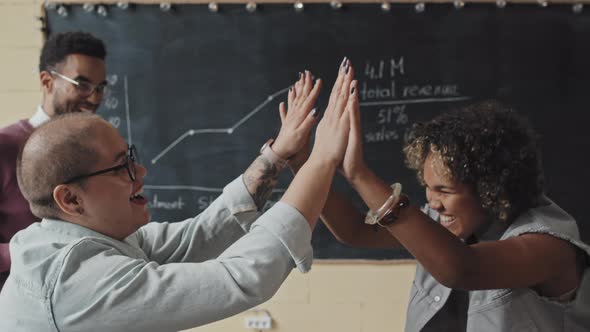 Young Colleagues High-fiving