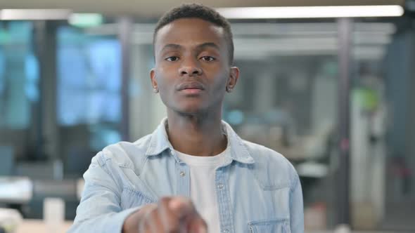 Portrait of African Man Pointing at the Camera