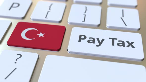 PAY TAX Text and Flag of Turkey on the Computer Keyboard