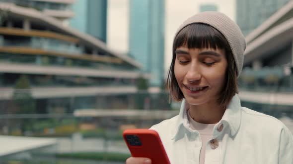 Woman Using Smartphone for Online Shopping Outdoors