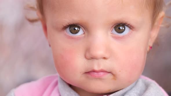 Beautiful Baby Face Looking Into the Camera Lens