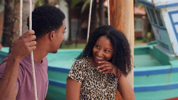 Beautiful Young Woman Talking To a Young Man with Very Expressive Face