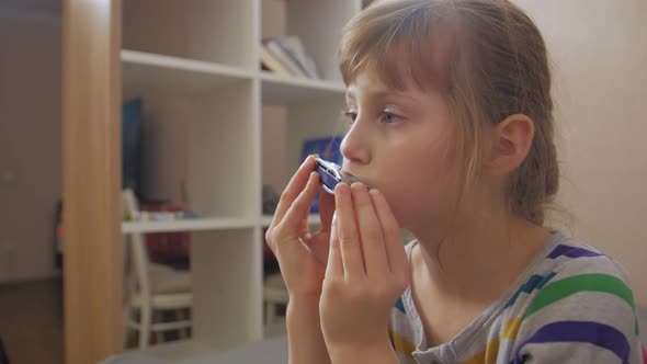 Sad Girl Playing Harmonica