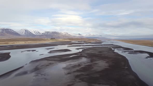 Aerial view over a glacial river system surrounded by a wilderness gorgeous landscape in Iceland