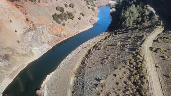 Slowly flying over the North Fork American river in the Sierra Nevada.Camera tilting down while flyi