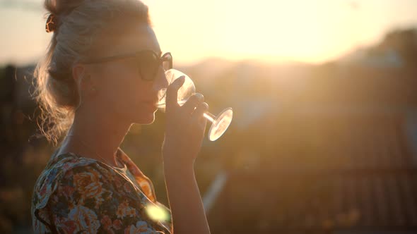 Woman Drinking White Wine Holidays Vacation. Romantic Evening Enjoying Wineglass. Celebrating.