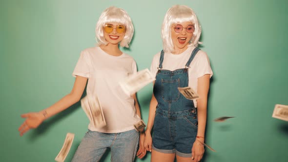 Two carefree young girls going crazy in studio