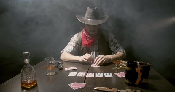 Poker table in the bar, cowboy is playing poker in the smoke, 4k