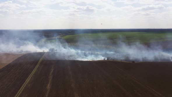 Aerial View of Big Smoke Clouds and Fire on the Field