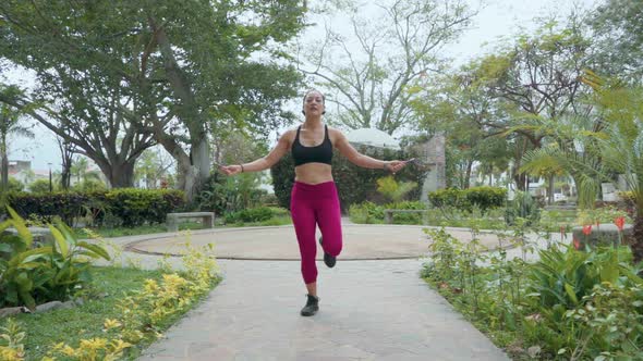 Woman Jumping Rope with One Foot
