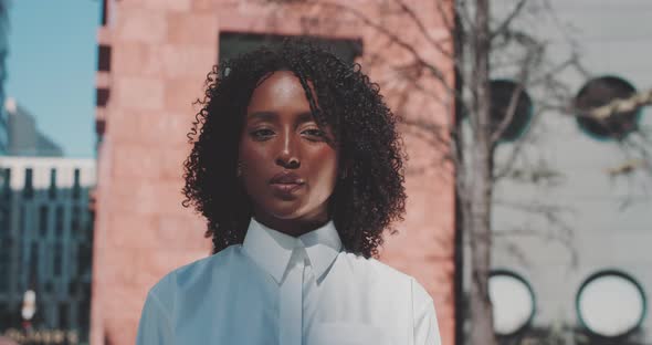 Young woman looks around in Business district