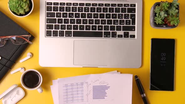 Business woman hands working with reports top view