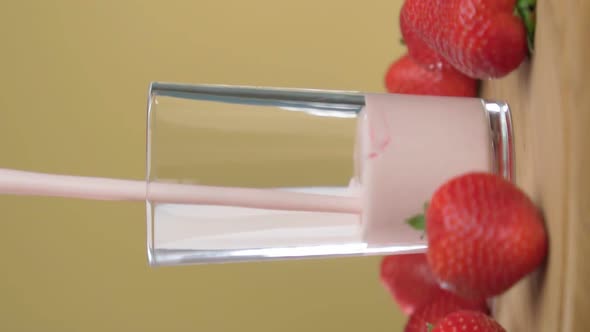 Strawberry Yogurt is Poured Into a Glass