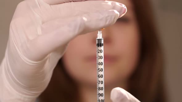 Close-up of a Woman Picking Up Insulin in an Insulin Syringe