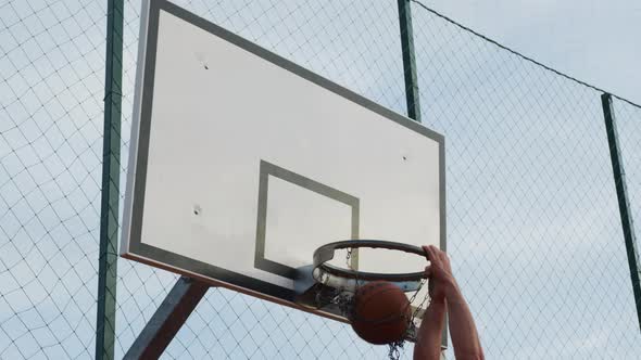 Scoring a point while playing basketball