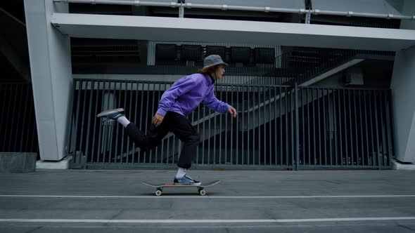 Young Skater Guy Riding Outside